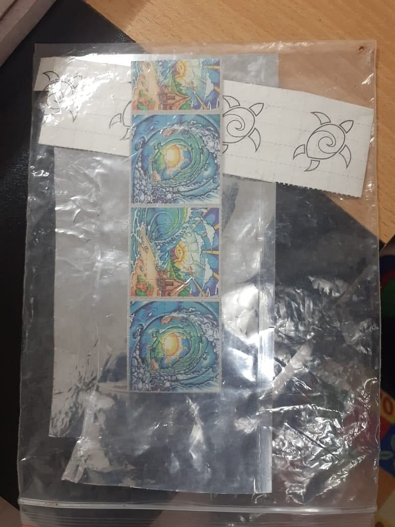 Photo shows blotter paper that is used in the process of consuming lysergic acid diethylamide or LSD.