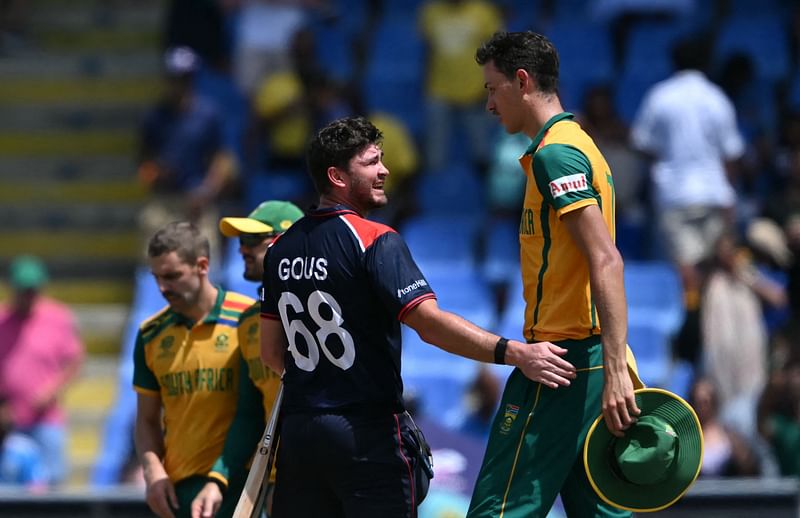 USA's Andries Gous speaks with South Africa's Marco Jansen after South Africa won the ICC men's Twenty20 World Cup 2024 Super Eight cricket match between the United States and South Africa at Sir Vivian Richards Stadium in North Sound, Antigua and Barbuda on 
19 June, 2024