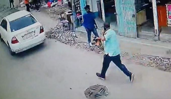 Footage from CCTV cameras shows a man holding a pistol is running behind a car after a group of people drag another person to the vehicle in broad daylight in Dhaka on 9 June 2024.