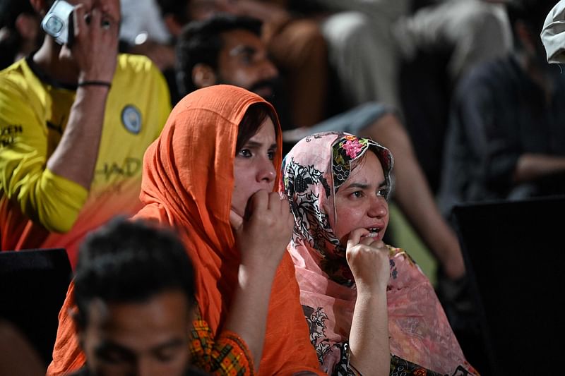 akistan cricket supporters react after India defeated Pakistan during a live broadcast of the 2024 ICC men's Twenty20 World Cup group A cricket match between Pakistan and India played in New York, at the Rawalpindi Cricket Stadium in Rawalpindi on June 10, 2024