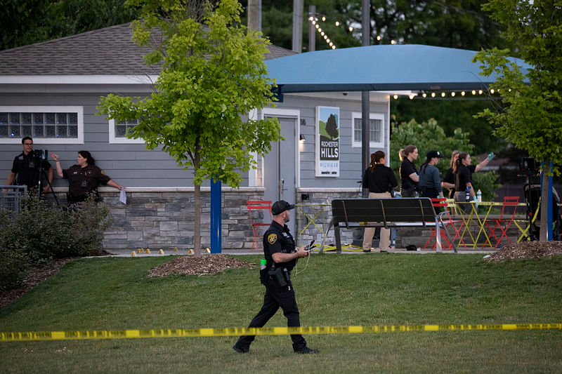 Police investigate the scene of a shooting at the Brooklands Plaza Splash Pad on 15 June, 2024 in Rochester Hills, Michigan.