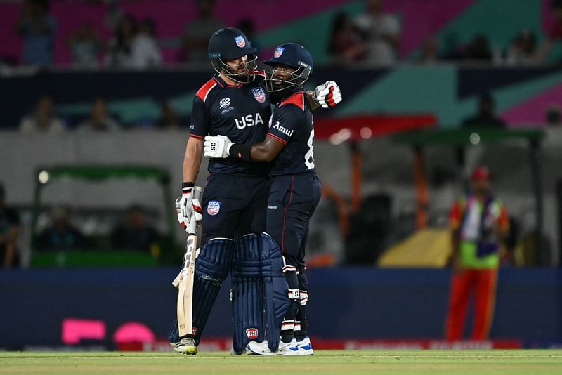 USA's vice-captain Aaron Jones (R) celebrates a half century (50 runs) during the ICC men's Twenty20 World Cup 2024 group A cricket match between the USA and Canada at the Grand Prairie Cricket Stadium in Grand Prairie, Texas on 1 June, 2024.