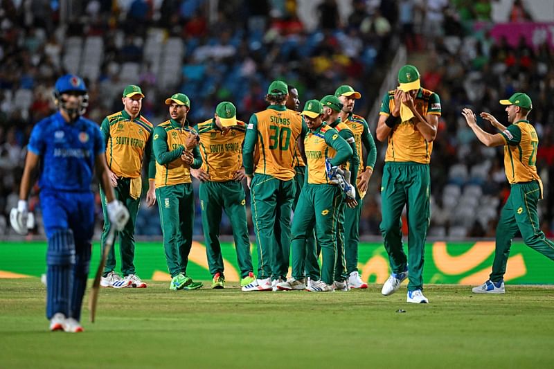 South Africa’s players celebrate after the dismissal of Afghanistan’s Ibrahim Zadran (L) during the ICC men’s Twenty20 World Cup 2024 semi-final cricket match between South Africa and Afghanistan at Brian Lara Cricket Academy in Tarouba, Trinidad and Tobago, on 26 June, 2024