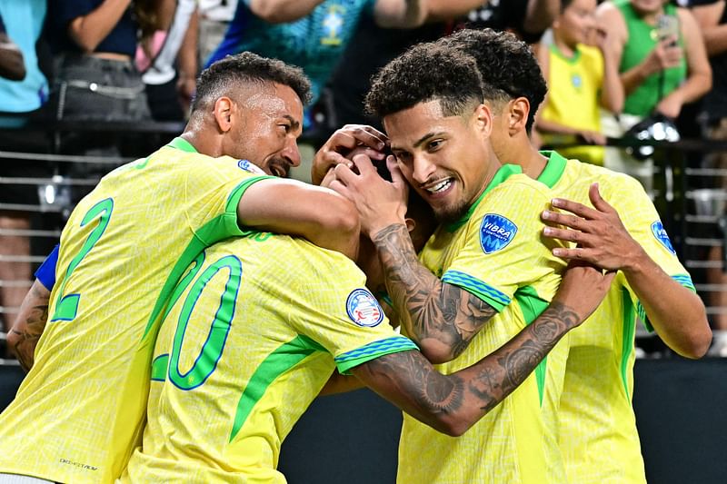 Brazil's forward Savinho (2nd L) celebrates with teammates after scoring the team's second goal during the Conmebol 2024 Copa America tournament group D football match between Paraguay and Brazil at Allegiant Stadium in Las Vegas, Nevada on 28 June, 2024