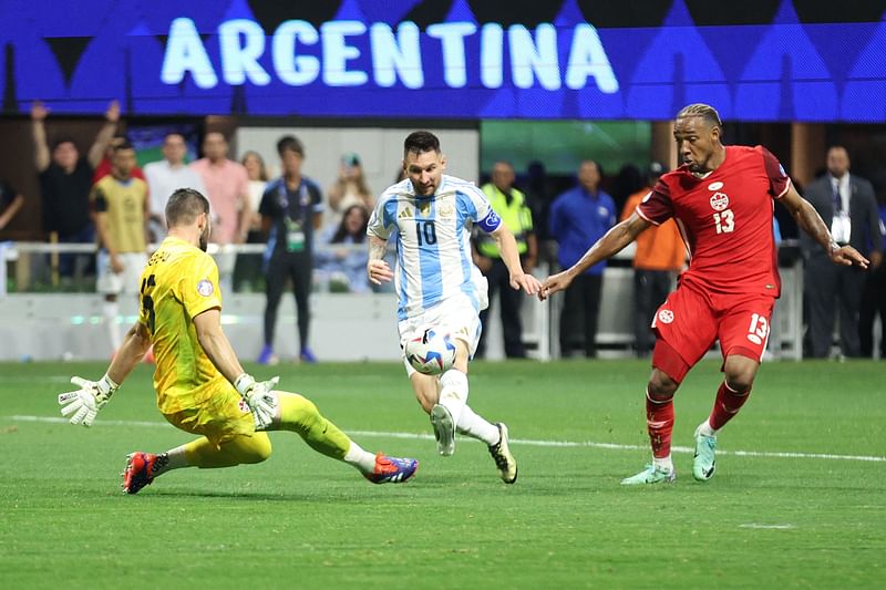 Maxime Crepeau and Derek Cornelius of Canada battle for possession with Lionel Messi of Argentina during the CONMEBOL Copa America group A match between Argentina and Canada at Mercedes-Benz Stadium on 20 June, 2024