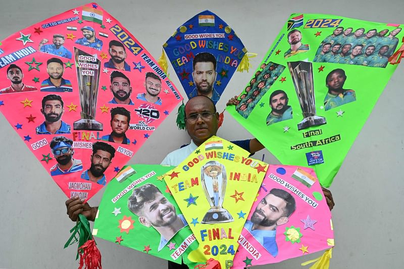 A kitemaker displays his kites decorated with pictures of Indian and South African cricket players in Amritsar on June 28, 2024, on the eve of the ICC men's Twenty20 World Cup 2024 final cricket match between India and South Africa.