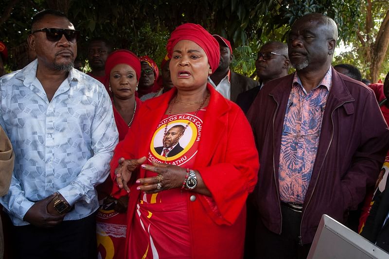 Secretary general for Malawi’s vice president Saulos Klaus Chilima’s UTM party, Patricia Kaliati (C), addresses supporters and sympathisers soon after a press briefing on 11 June, 2024.