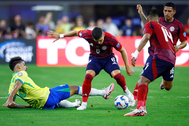 Lucas Paqueta of Brazil and Joseph Mora of Costa Rica battle for the ball during the CONMEBOL Copa America 2024 Group D match between Brazil and Costa Rica at SoFi Stadium on 24 June 2024 in Inglewood, California.