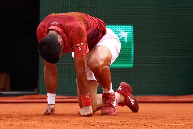 Serbia's Novak Djokovic reacts after falling on the court during his men's singles round of sixteen match against Argentina's Francisco Cerundolo on Court Philippe-Chatrier on day nine of the French Open tennis tournament at the Roland Garros Complex in Paris on 3 June, 2024