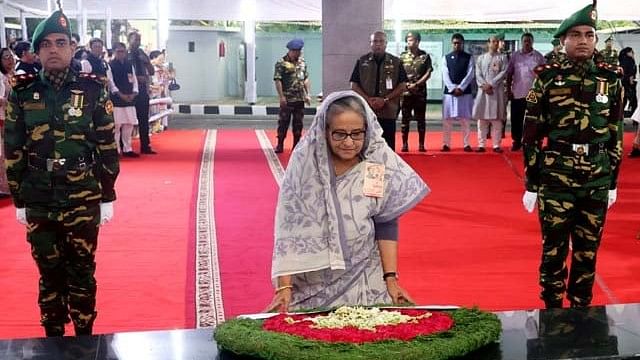 Prime Minister Sheikh Hasina pays tributes to Bangabandhu Sheikh Mujibur Rahman by placing a wreath at his portrait in front of Bangabandhu Memorial Museum at Dhanmondi, Dhaka, on the occasion of the historic Six-Point Day Friday