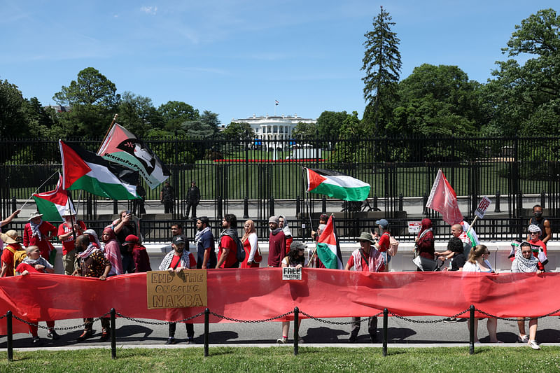 Hundreds of demonstrators surround the White House perimeter with a red banner symbolising President Biden’s ‘red line’ about Israel going into Gaza’s Rafah, during a pro-Palestinian protest, amid the Israel-Hamas conflict, in Washington, US, on 8 June, 2024