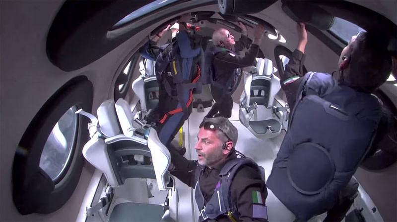 Giorgio Manenti of Italy looks out a window as Virgin Galactic's Galactic 07 mission carries four Turkish, US and Italian passengers to the edge of space and back aboard its spaceplane on a flight lasting slightly more than an hour, originating from Spaceport America near Truth or Consequences, New Mexico, US 8 June, 2024 in a still image from a video.