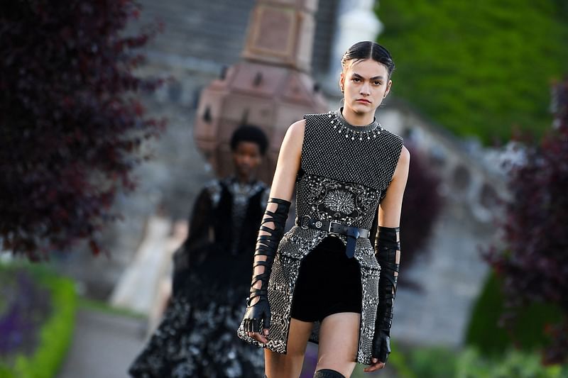 A model presents a creation for Dior during the 2025 Dior Croisiere (Cruise) fashion show on 3 June, 2024 at Drummond Castle, in Crieff, in Scotland.