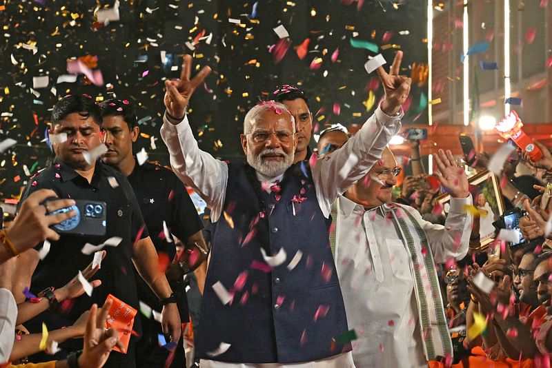 India’s Prime Minister Narendra Modi flashes victory sign as he arrives at the Bharatiya Janata Party (BJP) headquarters to celebrate the party’s win in country’s general election, in New Delhi on 4 June, 2024