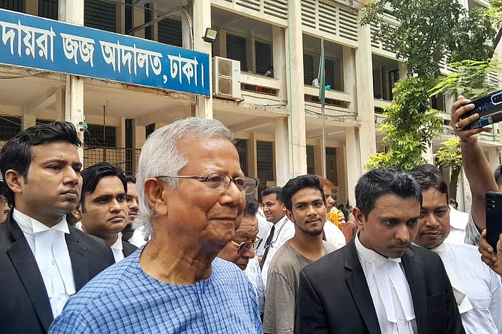 Nobel laureate Dr Muhammad Yunus speaks to the newspersons at the court premises today