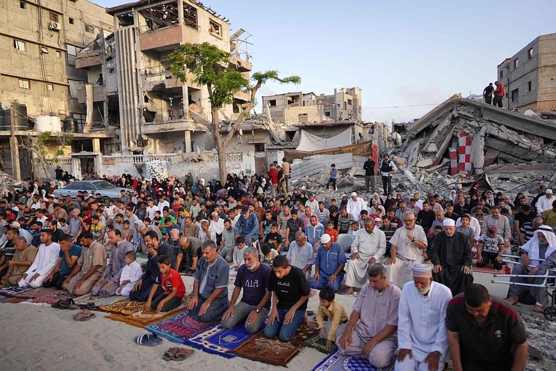 Palestinians perform the Eid al-Azha morning prayer in Khan Yunis in the southern Gaza Strip, on the first day of the Muslim holiday marking the end of the hajj pilgrimage to Mecca, on 16 June, 2024.