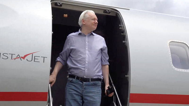 WikiLeaks founder Julian Assange disembarks from a plane at Bangkok Don Mueang International Airport, Thailand, in this screengrab from a video released to social media on 25 June, 2024