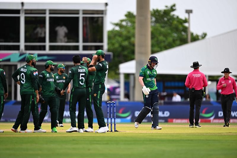 Ireland's George Dockrell (C) walks out after being dismissed during the ICC men's Twenty20 World Cup 2024 group A cricket match between Pakistan and Ireland at Central Broward Park & Broward County Stadium in Lauderhill, Florida on 16 June 2024.