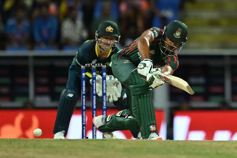 Bangladesh's captain Najmul Hossain Shanto plays a shot during the ICC men's Twenty20 World Cup 2024 Super Eight cricket match between Australia and Bangladesh at Sir Vivian Richards Stadium in North Sound, Antigua and Barbuda, on 20 June, 2024.