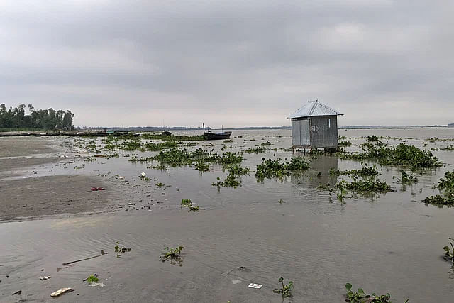 Water of Teesta and Dudh Kumar rivers is flowing above the danger level due to downpour from the upstream. The photo was taken from Jatrapur ferry ghat area.