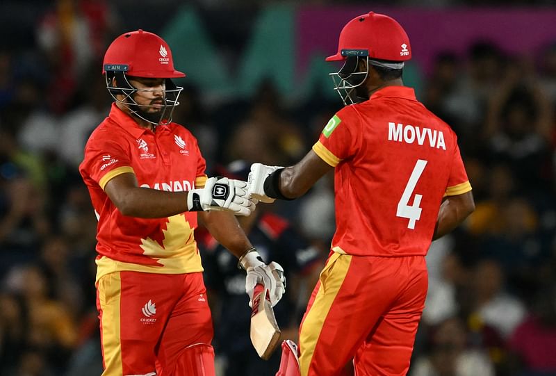 Canada's Dilpreet Bajwa (L) and Shreyas Movva celebrate during the ICC men's Twenty20 World Cup 2024 group A cricket match with the USA at the Grand Prairie Cricket Stadium in Grand Prairie, Texas on 1 June, 2024.