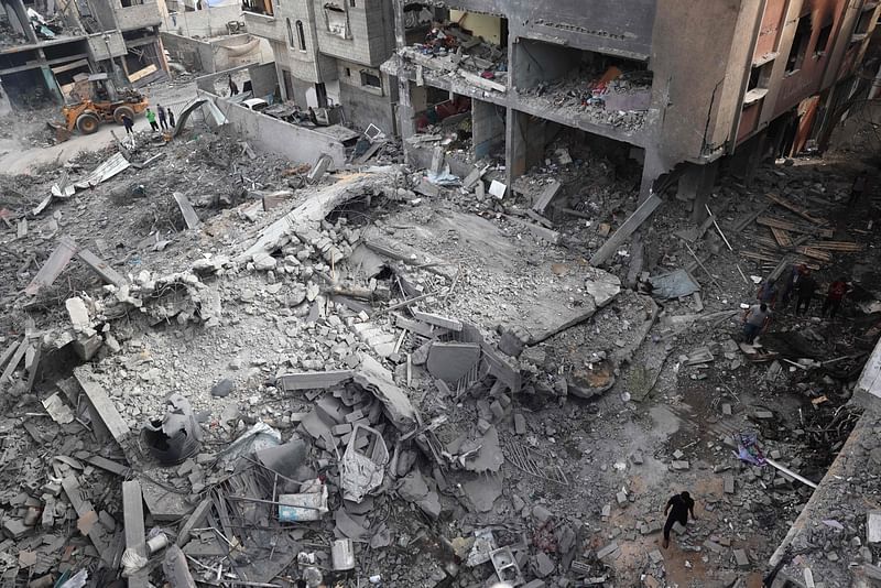 Palestinians inspect the damage and debris a day after an operation by the Israeli Special Forces in the Nuseirat camp, in the central Gaza Strip on 9 June, 2024, amid the ongoing conflict between Israel and the Palestinian Hamas militant group