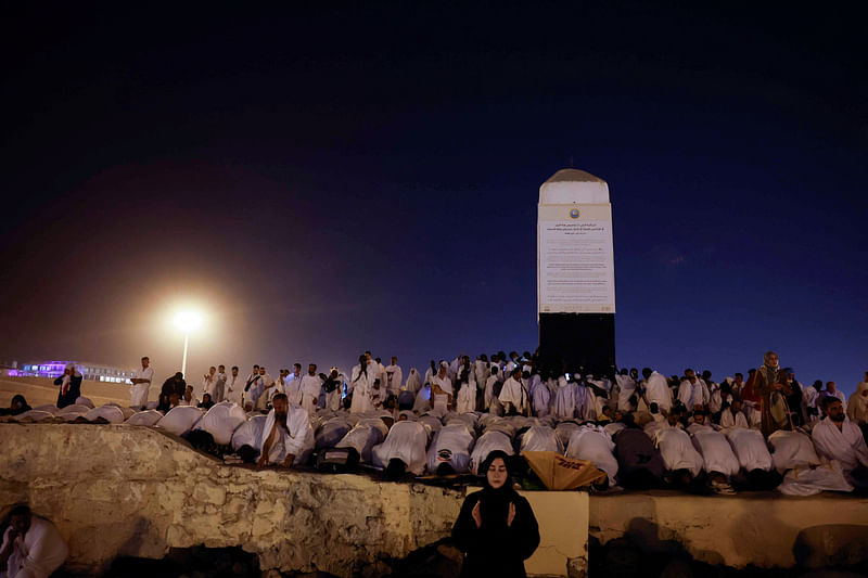 Muslim pilgrims gather at Mount of Mercy on the plain of Arafat during the annual haj pilgrimage, outside the holy city of Mecca, Saudi Arabia, 15 June 2024.