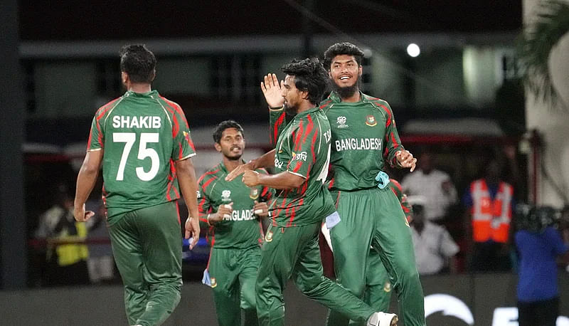 Tanzim Hasan Sakib celebrates with teammates after picking up a wicket against Nepal