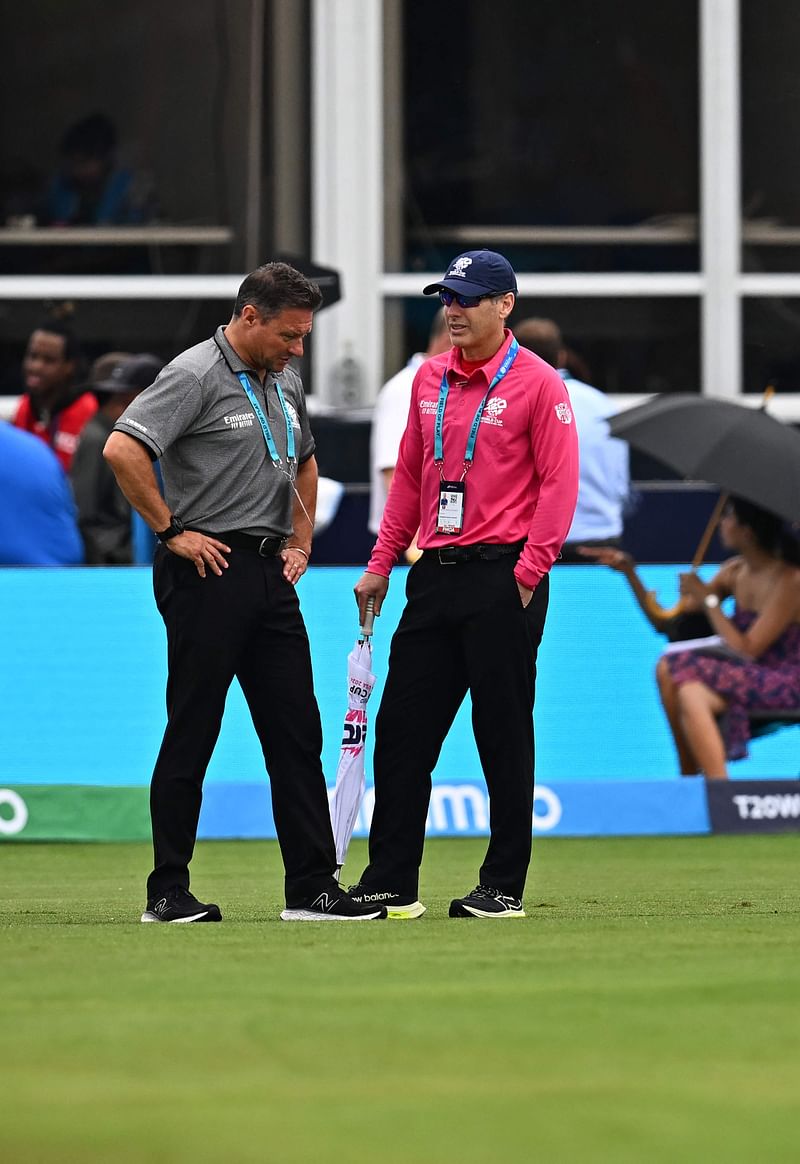 Match officials speak as they inspects the field during a delay in the start of the ICC men's Twenty20 World Cup 2024 group A cricket match between India and Canada at Central Broward Park & Broward County Stadium in Lauderhill, Florida on 15 June 2024.