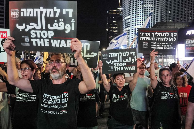 Protesters gather during an anti-government demonstration outside the defence ministry headquarters in Tel Aviv on 15 June, 2024, calling for early elections, the return of the hostages held captive in the Gaza Stip since the 7 October attacks, and an end to the ongoing conflict in the Palestinian territory between Israel and Hamas.