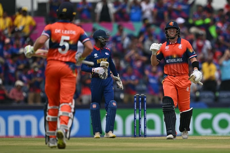 Netherland’s Max O’Dowd (L) celebrates winning with Netherland’s Bas de Leede during the ICC men's Twenty20 World Cup 2024 group D cricket match between the Netherlands and Nepal at the Grand Prairie Cricket Stadium in Grand Prairie, Texas on June 4, 2024.