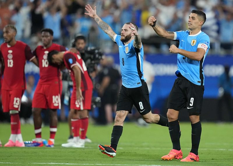 Luis Suarez of Uruguay and teammates celebrate winning in the penalty shootout during the CONMEBOL Copa America 2024 third place match between Uruguay and Canada at Bank of America Stadium on 13 July 2024 in Charlotte, North Carolina.