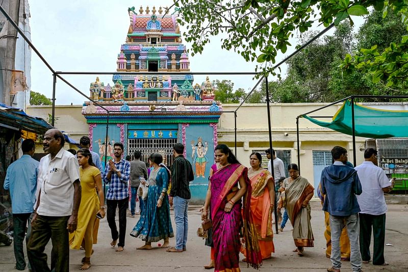 In this photo taken on 24 July 2024, Hindu devotees walk around the inner chamber of Chilkur Balaji temple popularly known as 'Visa Balaji Temple' at Chilkur village, Rangareddy district about 30 kms from Hyderabad.