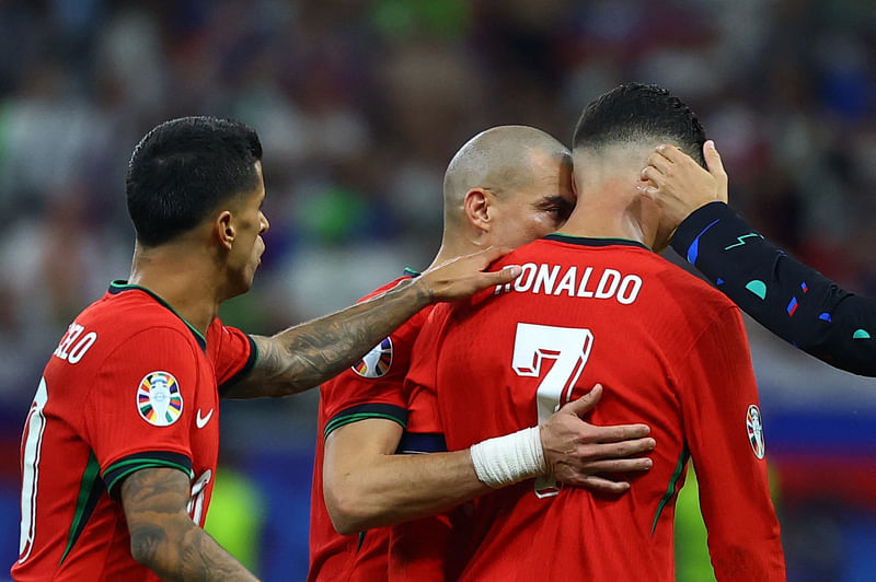 Portugal's Pepe consoles Cristiano Ronaldo as he looks dejected at half time of extra time