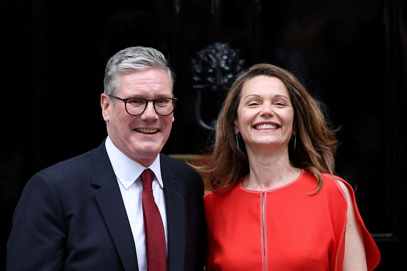 British Prime Minister Keir Starmer and his wife Victoria Starmer stand outside Downing Street 10, following the results of the election, in London, Britain, 5 July 2024.