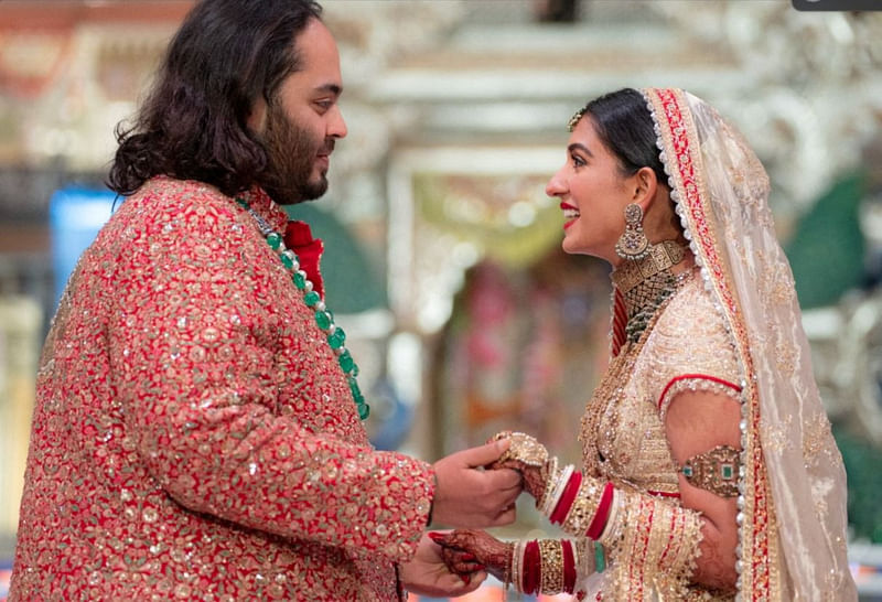 Anant Ambani, son of Indian billionaire Mukesh Ambani, and Radhika Merchant, daughter of industrialist Viren Merchant, react during their wedding celebrations in Mumbai, India, 12 July, 2024.