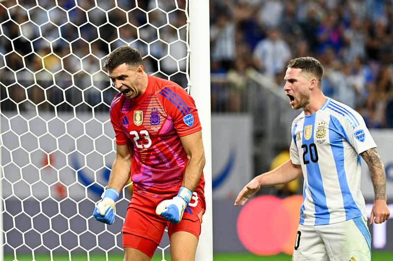 Argentina’s goalkeeper Emiliano Martinez (23) reacts after blocking a penalty kick during the second half against Ecuador at NRG Stadium, Houston, Texas, USA