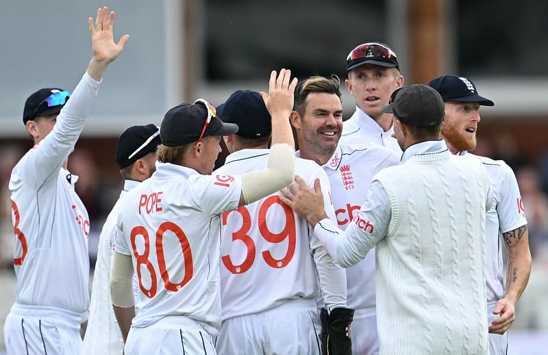 England's James Anderson (C) celebrates with teammates after the dismissal of West Indies Alick Athanaze during play on the second day of the first Test cricket match between England and West Indies at Lord's Cricket Ground in London on 11 July, 2024