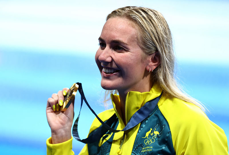 Paris 2024 Olympics - Swimming - Women's 400m Freestyle Victory Ceremony - Paris La Defense Arena, Nanterre, France - 27 July, 2024. Gold medallist Ariarne Titmus of Australia celebrates with her gold medal.