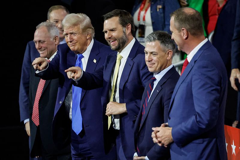 Republican presidential candidate, former US President Donald Trump (2nd-L) and Republican vice presidential candidate, US Sen. J.D. Vance (R-OH) (C) point to the crowd on the second day of the Republican National Convention at the Fiserv Forum on 16 July, 2024 in Milwaukee, Wisconsin. Delegates, politicians, and the Republican faithful are in Milwaukee for the annual convention, concluding with former President Donald Trump accepting his party’s presidential nomination