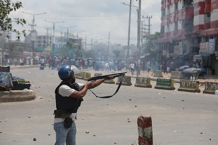 A police member opens fire towards the quota protesters