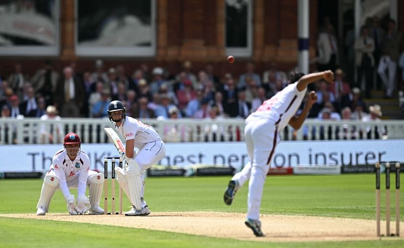 England's Jamie Smith (C) is watched by West Indies wicketkeeper Joshua Da Silva (L) as he prepares to plays a delivery from West Indies Gudakesh Motie (R) during play on the second day of the first Test cricket match between England and West Indies at Lord's Cricket Ground in London on July 11, 2024