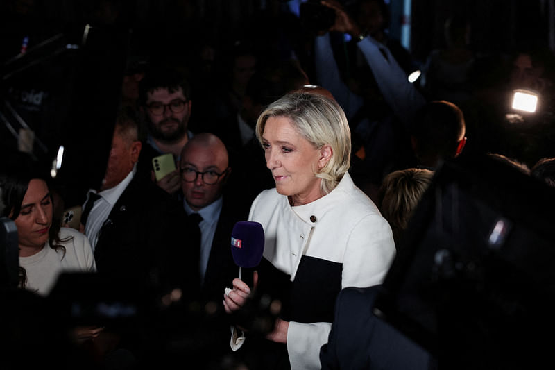 French far-right leader Marine Le Pen talks to journalists after partial results in the second round of the early French parliamentary elections, at the French far-right Rassemblement National (National Rally - RN) party venue in Paris, France, on 7 July, 2024