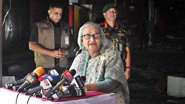 Prime Minister Sheikh Hasina speaks to the media after visiting the damaged BTV Bhaban in Dhaka on 26 July 2024