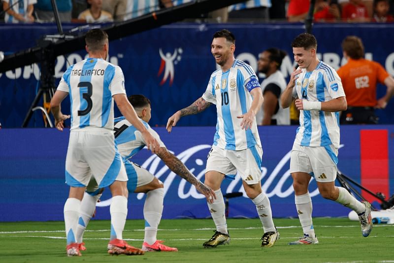 Argentina's forward #10 Lionel Messi celebrates with teammates after scoring his team's second goal during the Conmebol 2024 Copa America tournament semi-final football match between Argentina and Canada at MetLife Stadium, in East Rutherford, New Jersey on 9 July 2024.