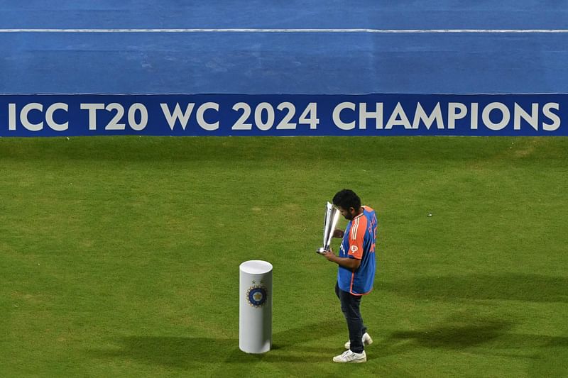 Captain of the Indian cricket team Rohit Sharma holds the trophy during a ceremony at the Wankhede stadium in Mumbai on 4 July 2024, to celebrate India's championship in the ICC men's Twenty20 World Cup 2024 held in Barbados.