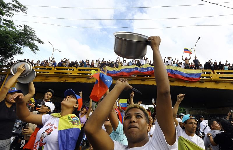 A man bangs a cooking pot during a protest against Venezuelan President Nicolas Maduro's government in Valencia, Carabobo state, Venezuela on 29 July 2024, a day after the Venezuelan presidential election.