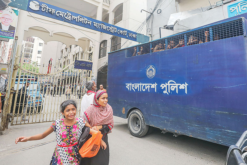 CNG-run autorickshaw driver Mizan was arrested from his house in Dhalpur on Sunday. Accompanied by her mother, Mizan's minor daughter Tayeba running with the prison van to catch a glimpse of her father. The picture was taken at CMM court premises on Monday afternoon