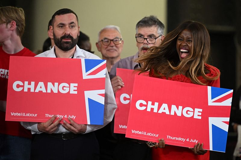 British TV presenter June Sarpong (R) celebrates during a Labour Party victory rally at the Tate Modern in London early on 5 July, 2024. The UK’s Labour Party swept to power after winning the country’s general election, crossing the 326-seat threshold for a working majority in the House of Commons