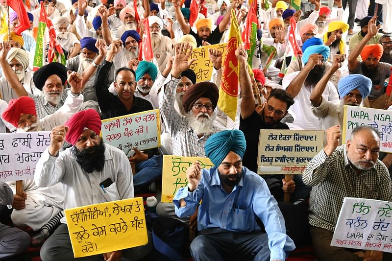 Activists from various organisations display placards and shout slogans against new criminal law and order to prosecute Indian author Arundhati Roy and former professor of International Law in Central University of Kashmir, Dr. Sheikh Showkat Hussain, under the UAPA law in a case relating to their alleged provocative speeches at a public function in 2010, during a protest in Amritsar on 1 July, 2024